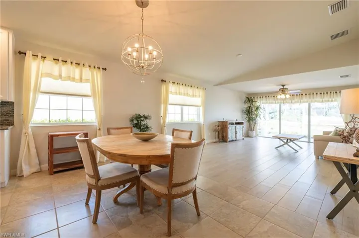 15416 Almaco Cir Bonita Springs FL 34135 - Dining area by kitchen and living room has lots of light through side iwindows