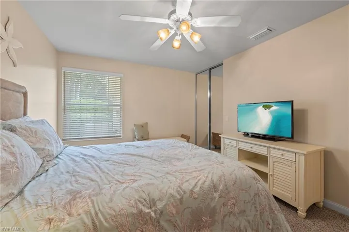 15416 Almaco Cir Bonita Springs FL 34135 - Bedroom 2 with lighted ceiling fan