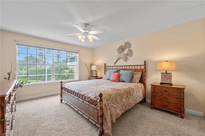 15416 Almaco Cir Bonita Springs FL 34135 - Owner's bedroom has a view of the long lake and walk in closet