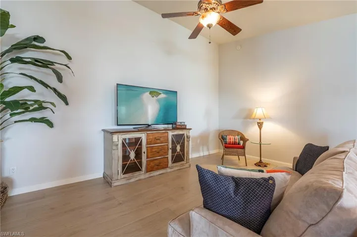 15416 Almaco Cir Bonita Springs FL 34135 - Living area with new flooring and neutral paint.