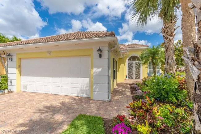 Mediterranean / spanish-style home with a garage