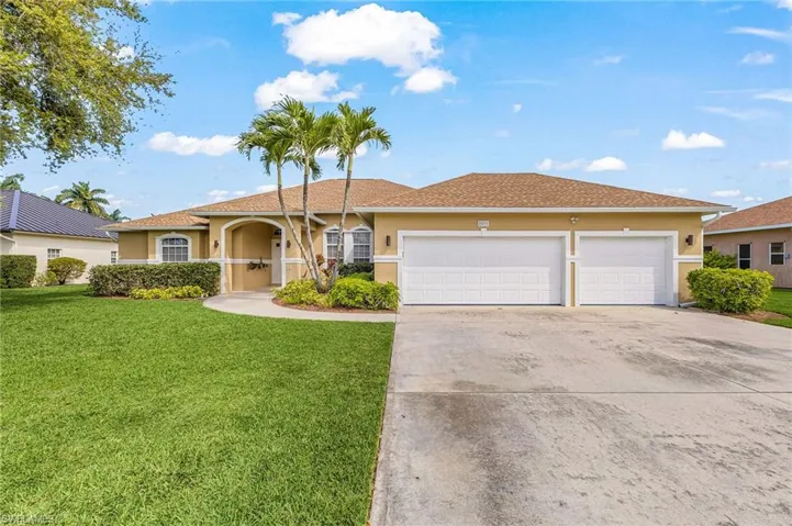 Single story home with stucco siding, a garage, concrete driveway, a front lawn, and roof with shingles