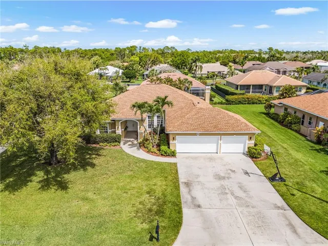 Aerial perspective of suburban area featuring a tree filled landscape