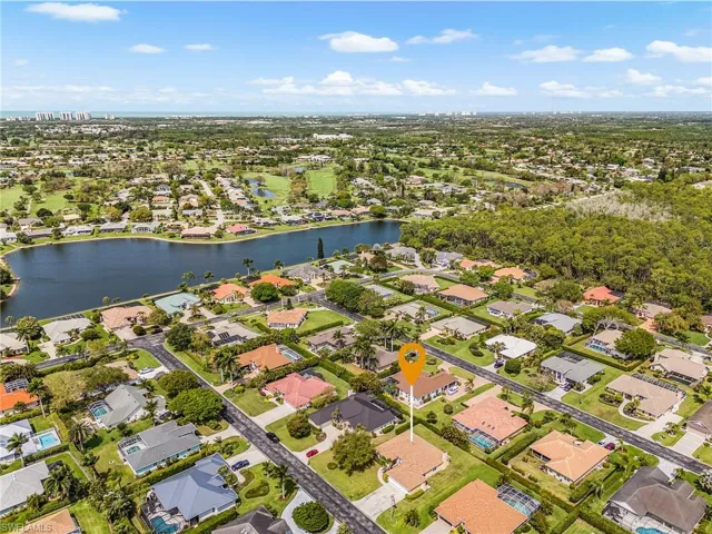 Aerial view of residential area with a large body of water