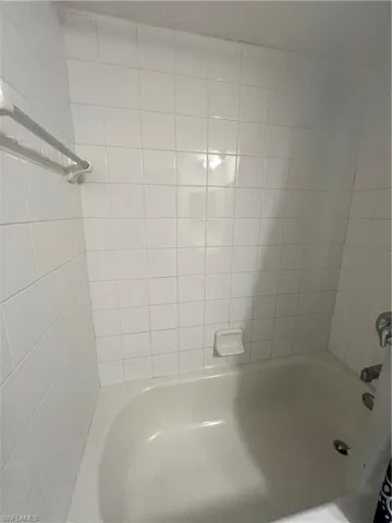 Full bath featuring shower / bathing tub combination