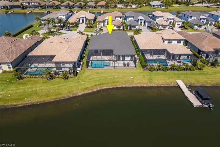 Drone / aerial view featuring a residential view and a water view