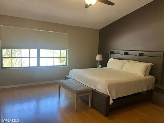 Bedroom featuring wood finished floors and ceiling fan