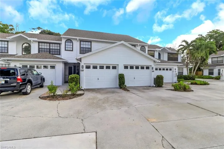 Traditional-style home with driveway and a garage