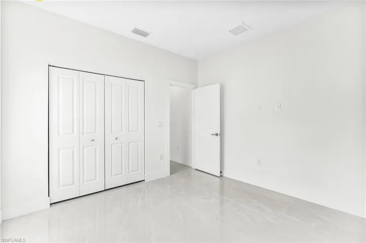 Unfurnished bedroom featuring a closet