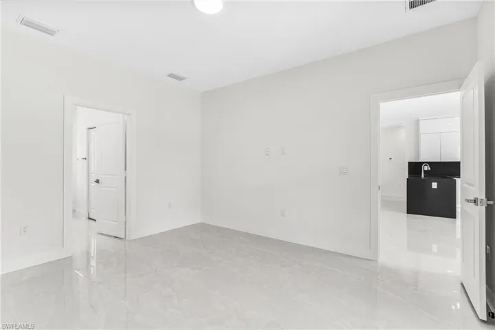 Unfurnished room featuring sink
