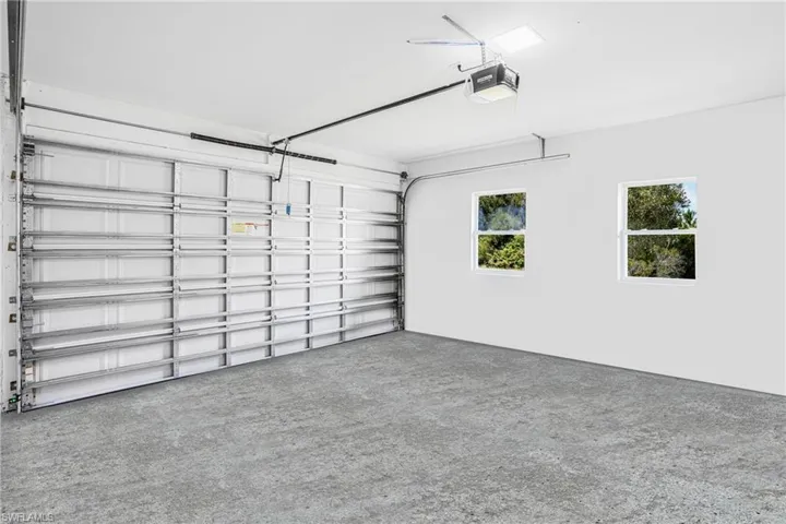 Garage featuring a garage door opener