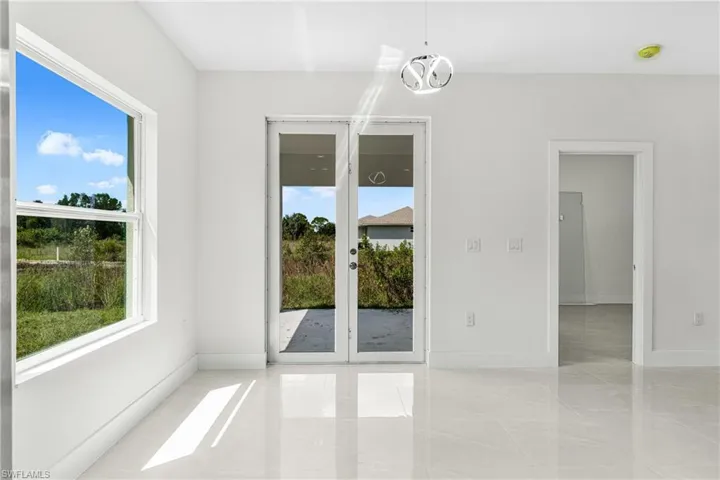 Empty room featuring an inviting chandelier