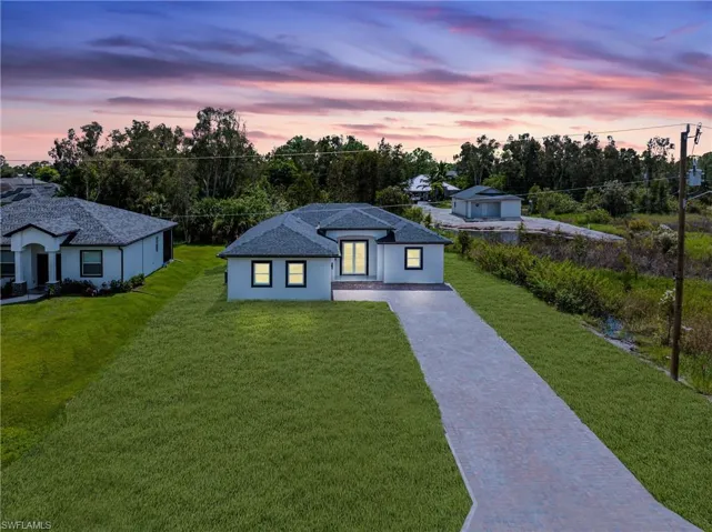 View of front of house featuring a lawn