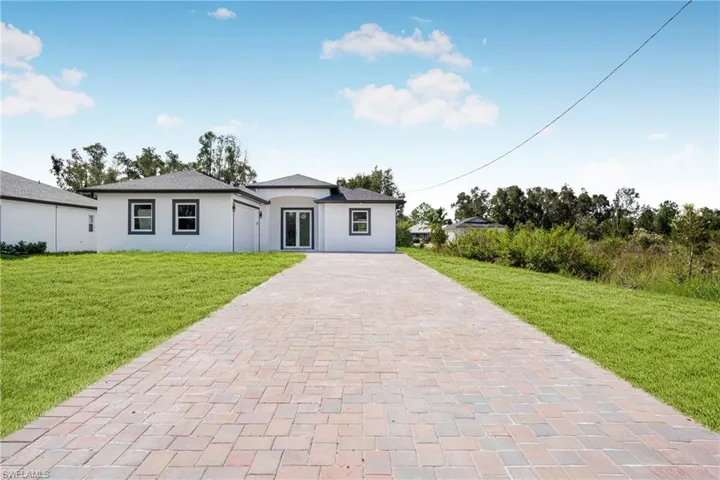 View of front of property featuring a front lawn