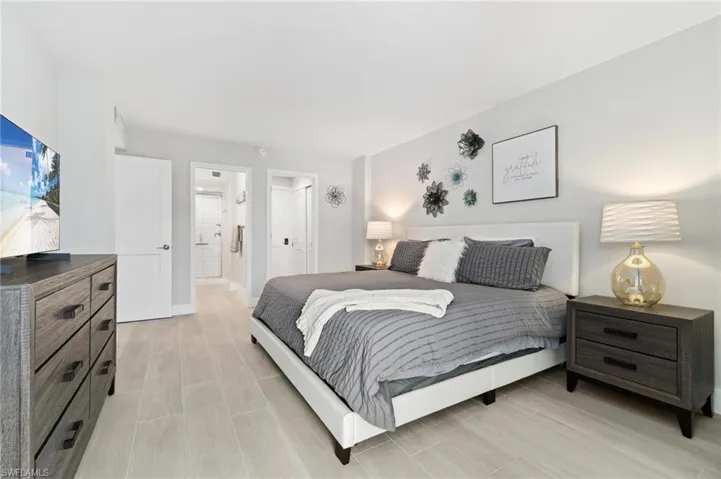 Bedroom featuring a closet and wood finish floors