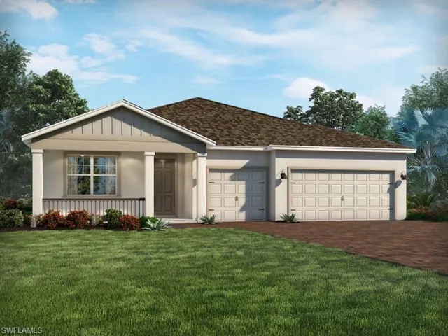 Ranch-style house featuring a garage and a front lawn