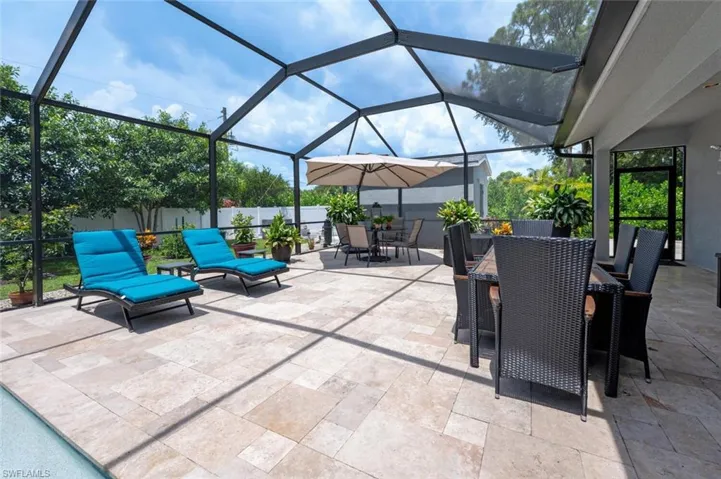 View of patio / terrace featuring outdoor dining area and a lanai