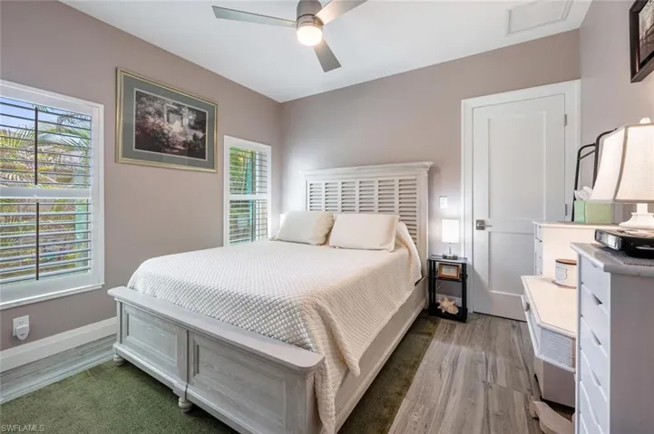 Bedroom featuring light wood finished floors and a ceiling fan