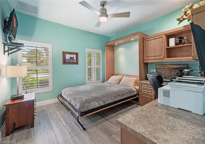 Bedroom featuring light wood-style flooring and ceiling fan