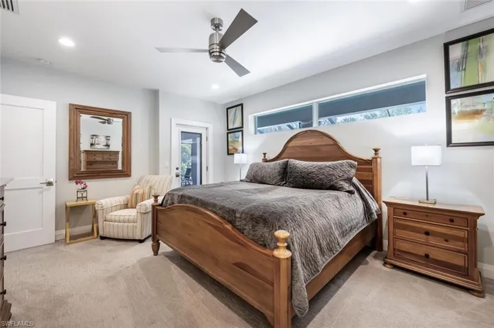 Bedroom featuring light carpet, access to exterior, recessed lighting, and ceiling fan
