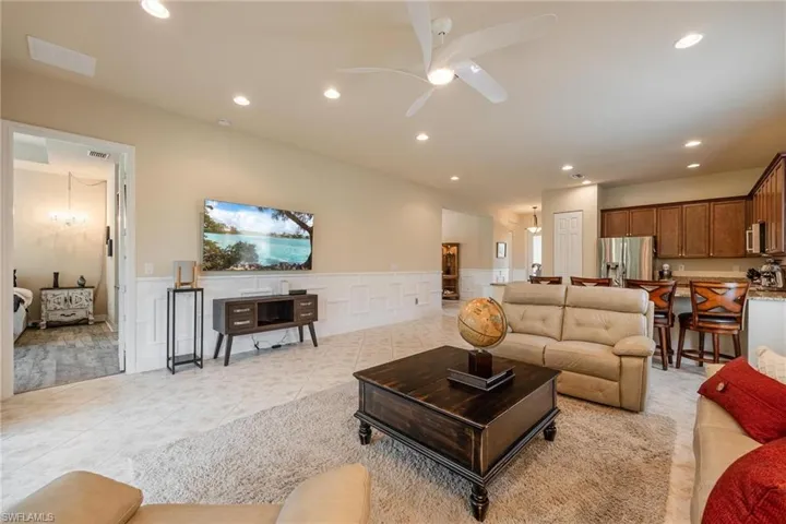 Tiled living room with ceiling fan