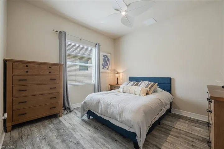 Bedroom with wood-type flooring and ceiling fan