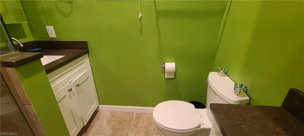 Bathroom with vanity and light tile patterned flooring