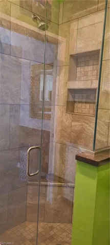 Full bath featuring a stall shower