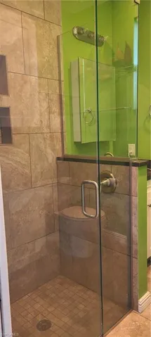 Bathroom featuring a shower stall
