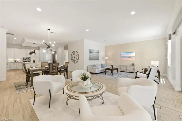 Open-concept interior featuring light wood-finish flooring throughout