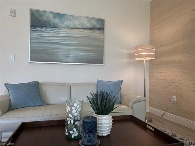 Living area featuring baseboards and wood finished floors