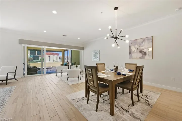 Open-concept living space featuring wood-finish flooring