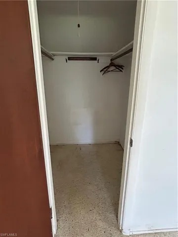 Walk in closet primary bedroom