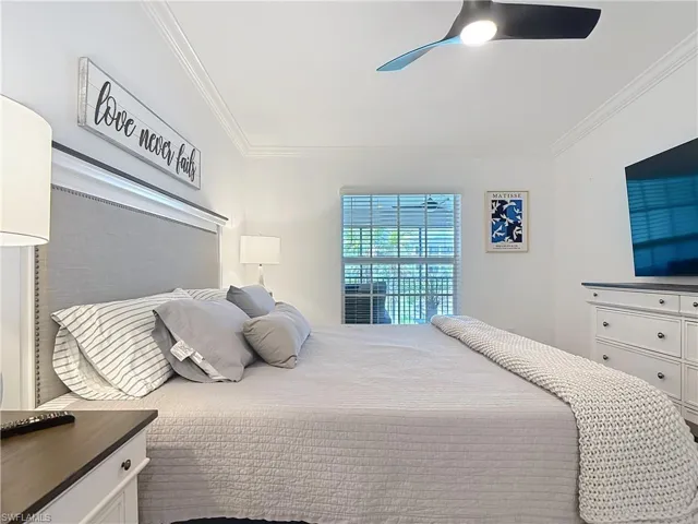 Bedroom featuring crown molding and ceiling fan