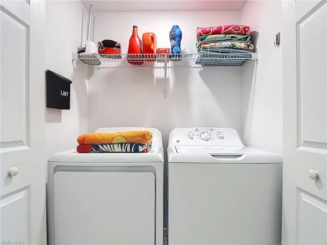 Laundry room featuring washer and clothes dryer
