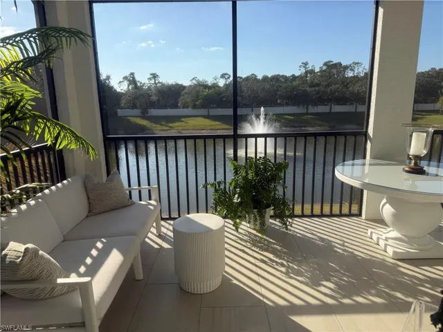 Outside screen lanai featuring plenty of natural light and a water view