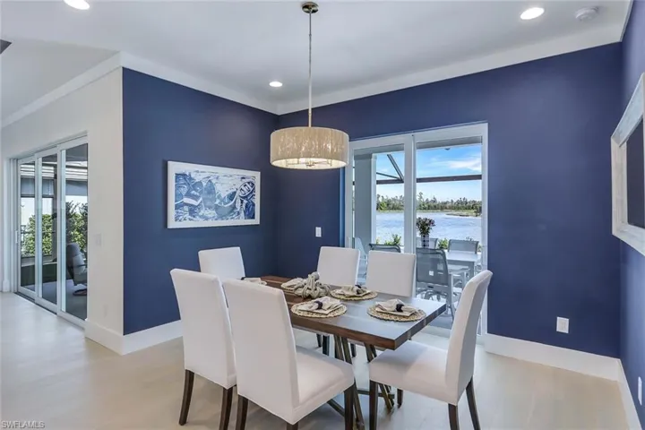 Dining area featuring a water view and light hardwood / wood-style flooring