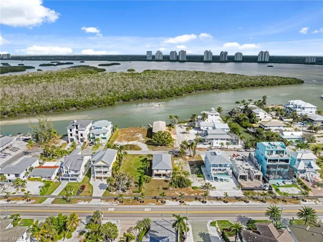 Drone / aerial view of city skyline and a large body of water