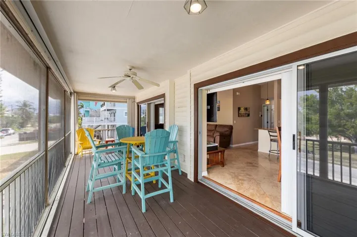 Sunroom / solarium with a ceiling fan
