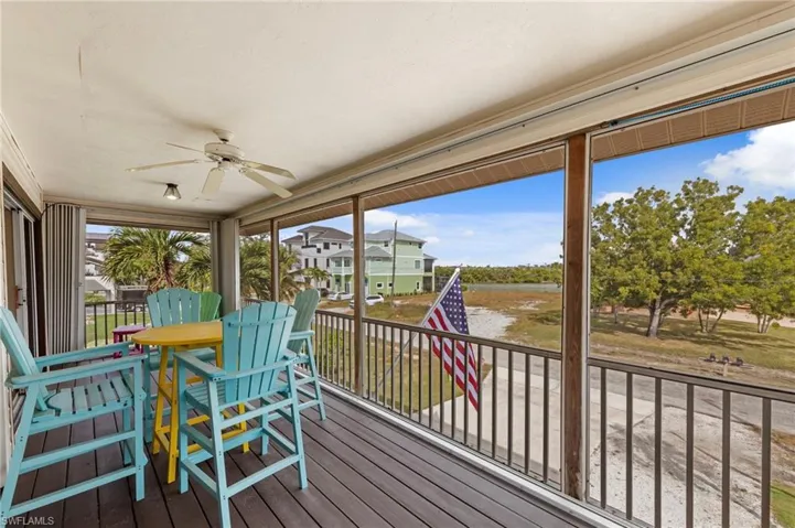 Sunroom featuring a ceiling fan