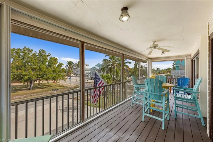 Sunroom with hardwood / wood-style floors