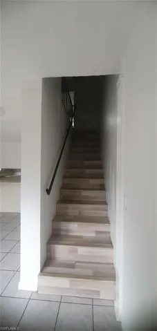 Staircase featuring tile patterned flooring