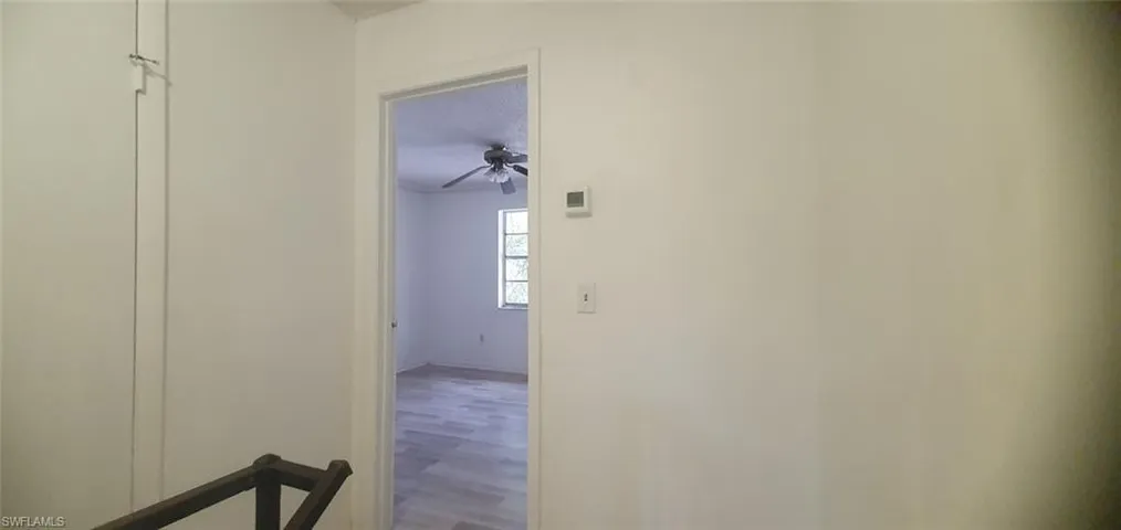 Hall featuring wood finished floors