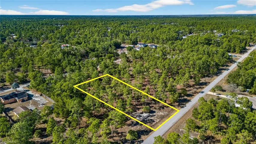 Aerial overview of property's location featuring a forest and property parcel outlined