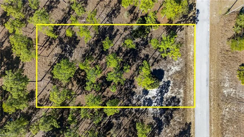 Aerial overview of property's location with property parcel outlined