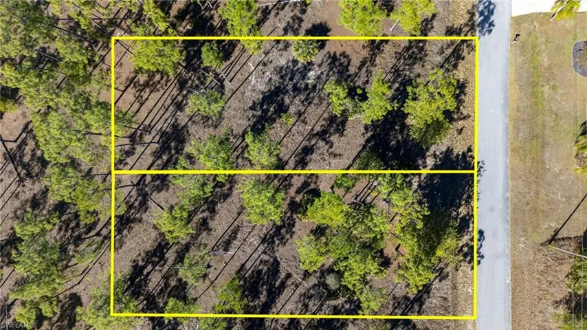 Aerial view of property's location featuring property parcel outlined