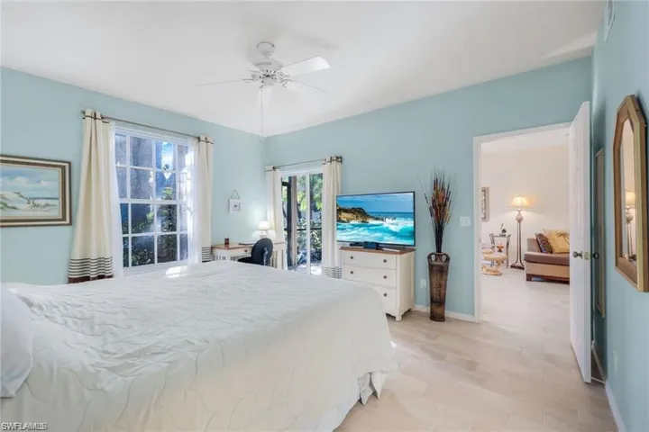 Bedroom featuring ceiling fan and baseboards