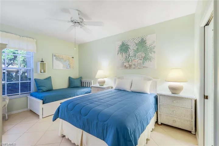 Bedroom featuring ceiling fan and light tile patterned flooring