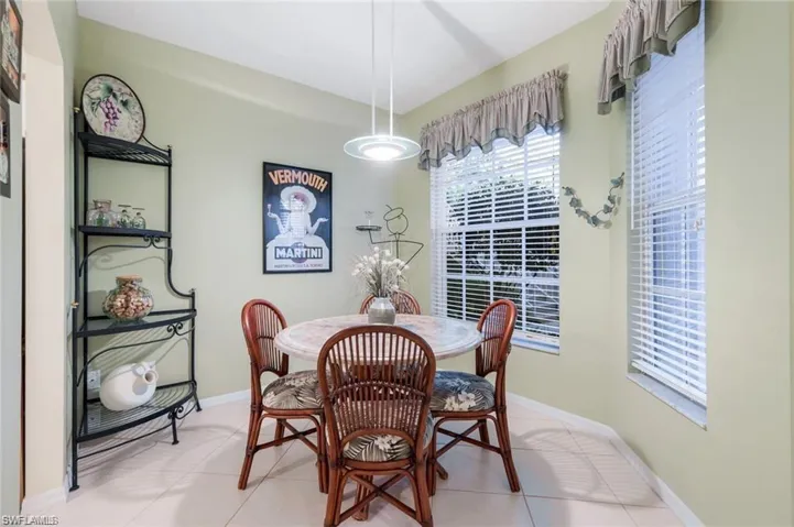 Tiled dining room with baseboards