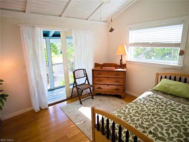 Upstairs 2nd bedroom, french doors to screened balcony #2 which leads to deck around the home